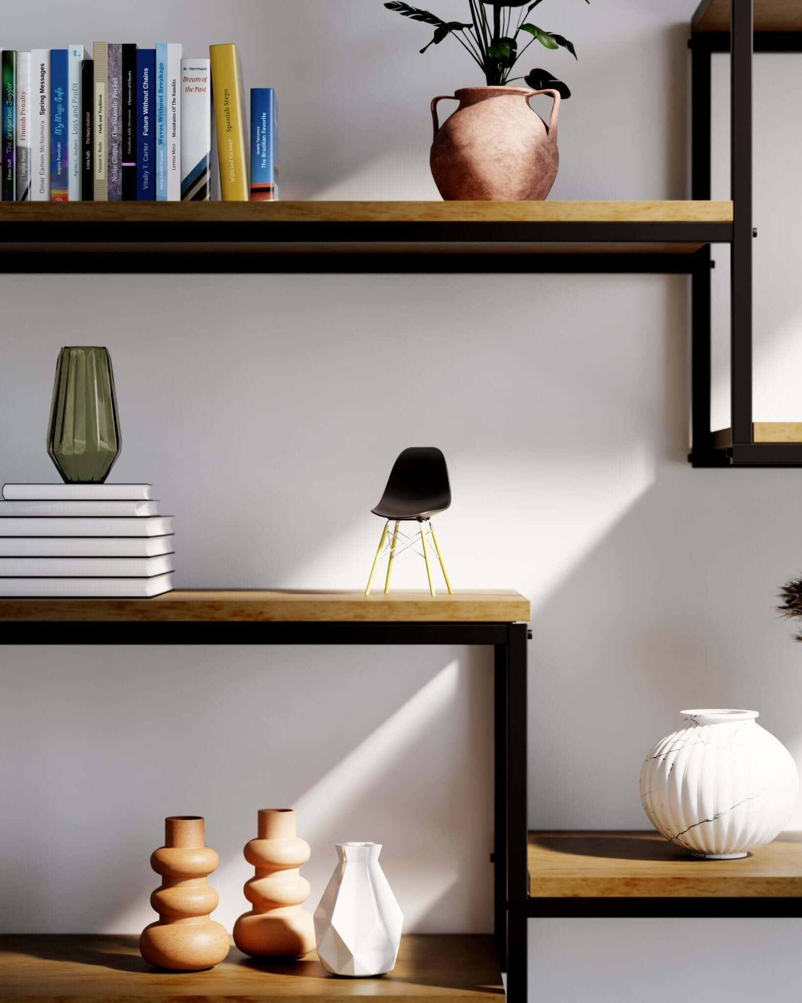 Miniature Black MicroShell chair displayed on wooden shelves with books and vases, showcasing mid-century modern design.