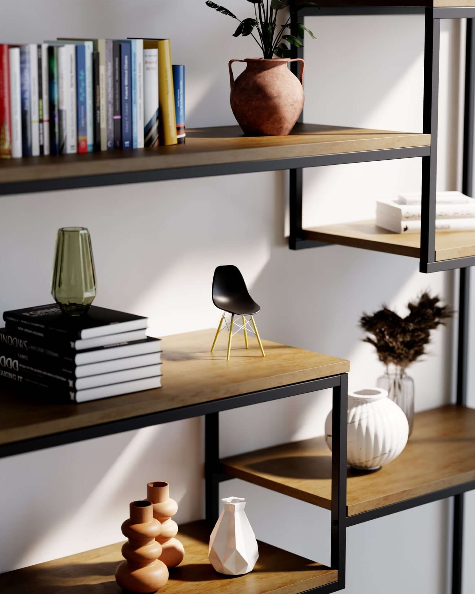 Miniature Black MicroShell chair displayed on a wooden shelf with books and vases, showcasing mid-century modern design.