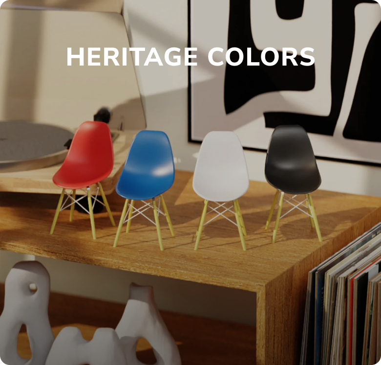 Colorful miniature chairs on a wooden shelf with the text 'Heritage Colors' on display in a modern interior setting.