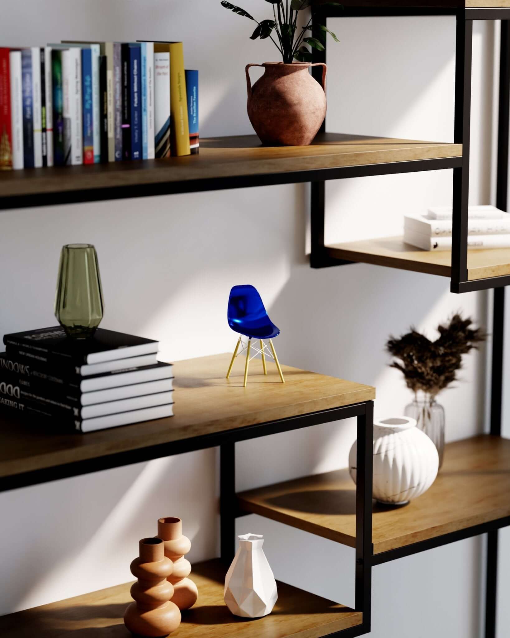 Miniature Metallic Blue MicroShell chair displayed on a wooden shelf with books and vases, showcasing mid-century modern design.