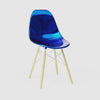 360-degree product rotation showing miniature Metallic Blue MicroShell Chair from every angle - front, sides, and back - highlighting curved shell design and scale details