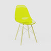 360-degree product rotation showing miniature Clear Yellow MicroShell Chair from every angle - front, sides, and back - highlighting curved shell design and scale details