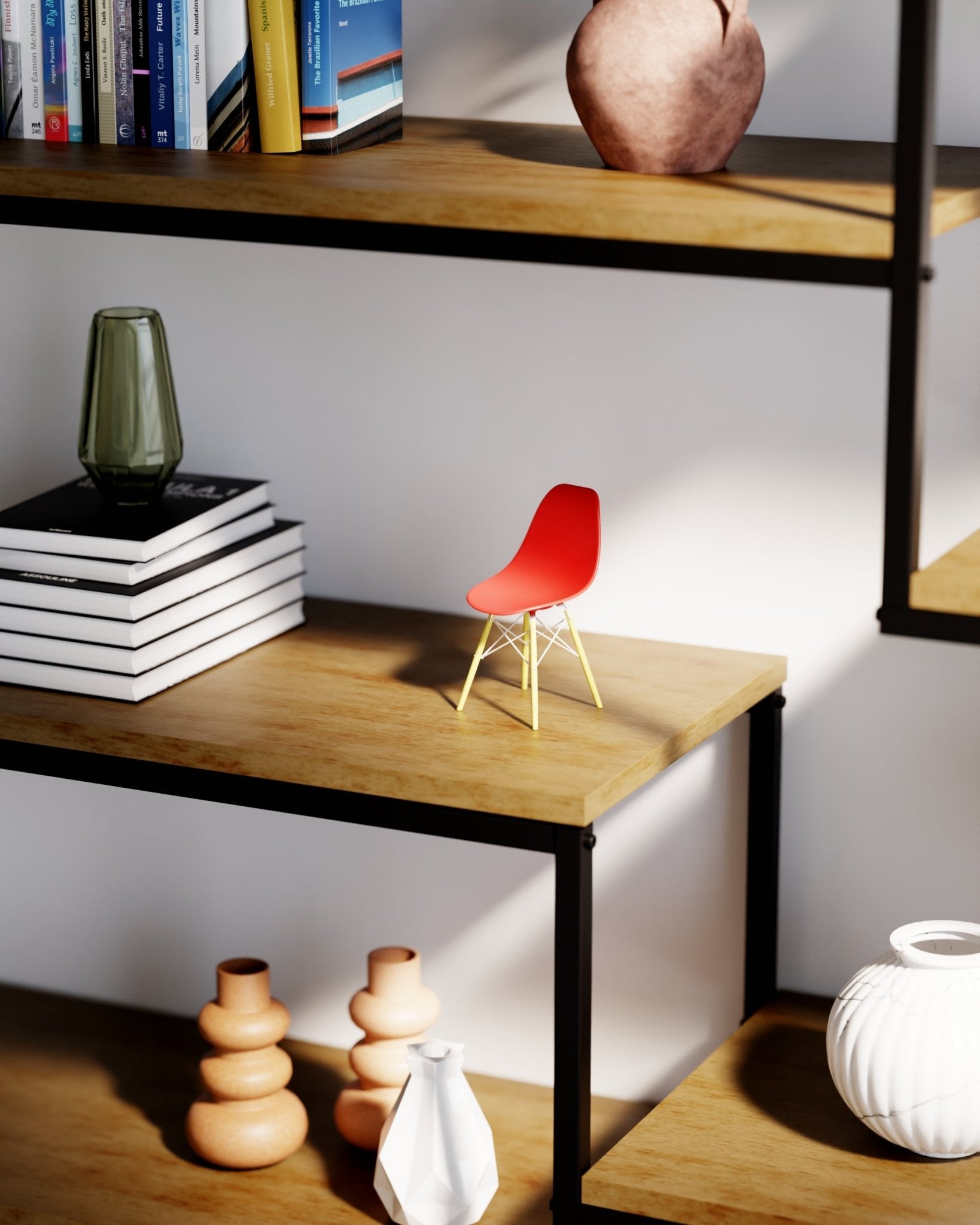 Miniature Red Orange MicroShell chair displayed on wooden shelves with books and vases, showcasing mid-century modern design.